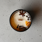 Fine Candle with Ambar Jar and decorations such as spices and orange slices