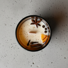 Fine Candle with Ambar Jar and decorations such as spices and orange slices